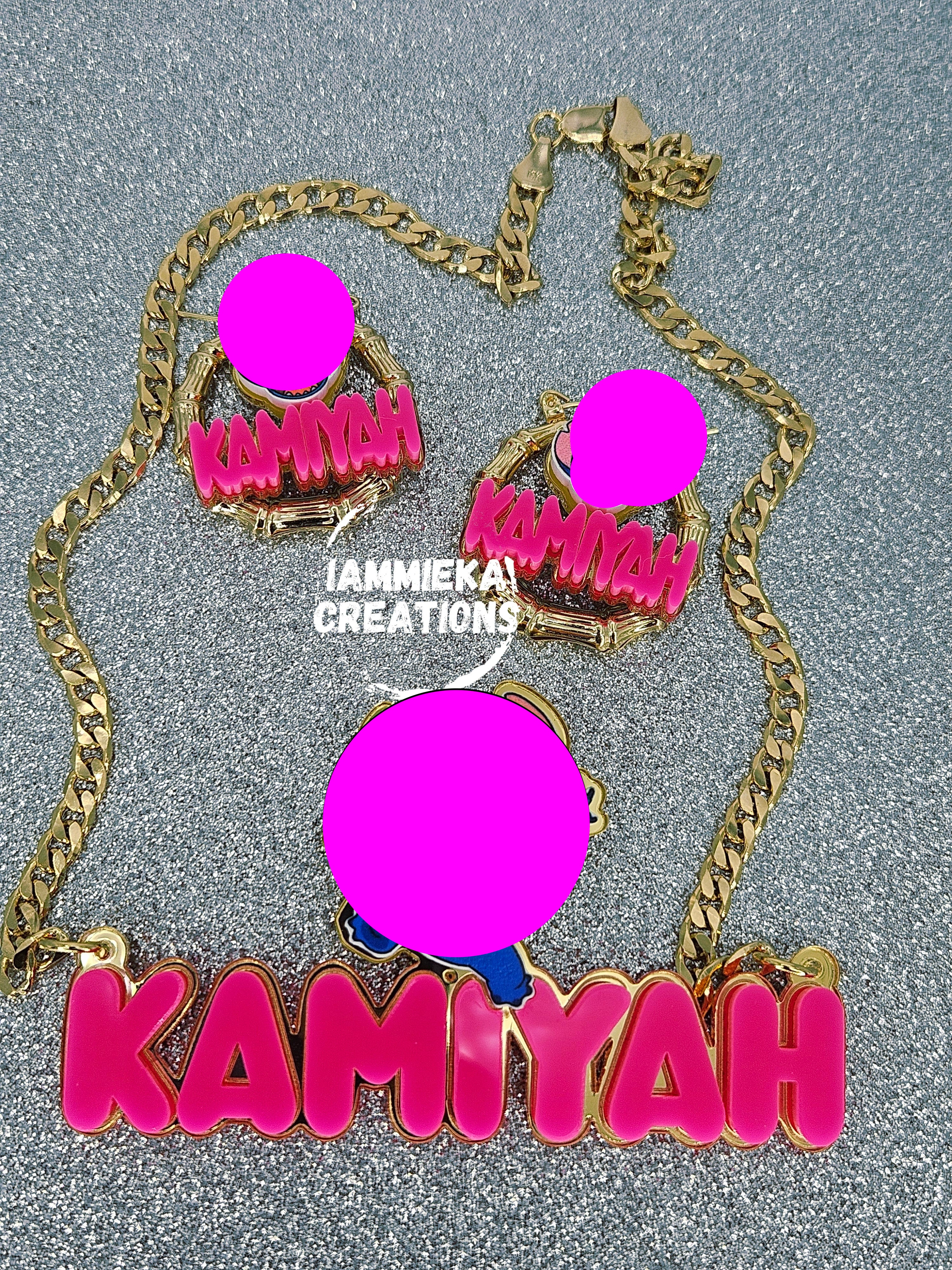 Necklace with matching earrings featuring a character design and 'Kamiyah' text on a gray background.